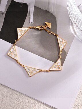 ✨A woman's Prada- Gold Bracelet with White EnamelTriangle Logos✨